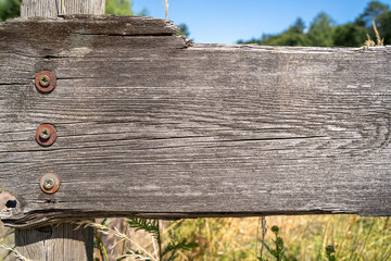 Old weathered wooden fence in the countryside
