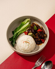 Beef stir-fried with black pepper sauce served with white rice