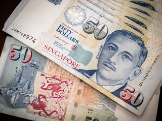 Singapore dollar money background. 50 Close-up Singapore dollars currency banknote. Business...