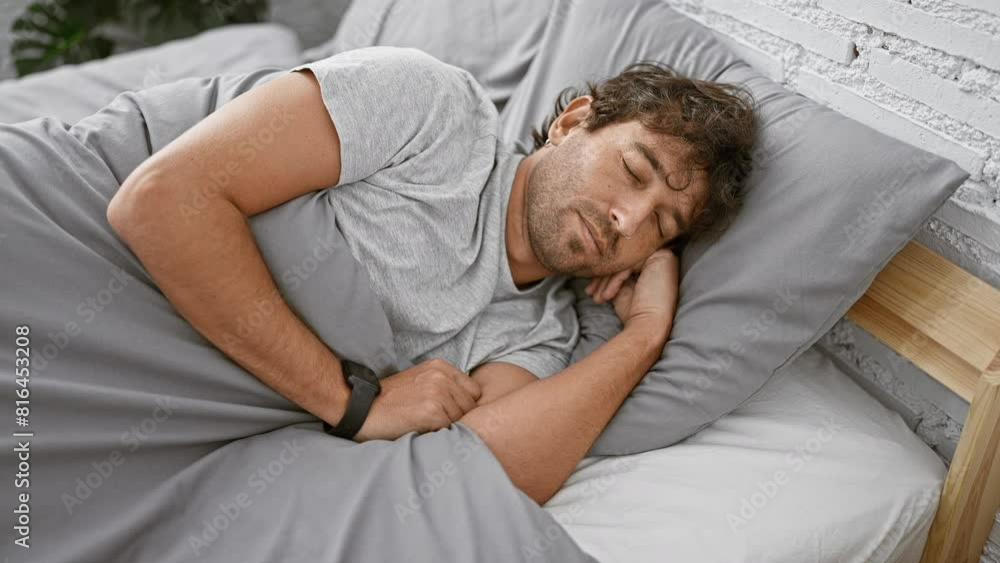 Sticker Man waking up in a modern bedroom, stretching while lying on a comfortable bed with stylish bedding and plants in the background.