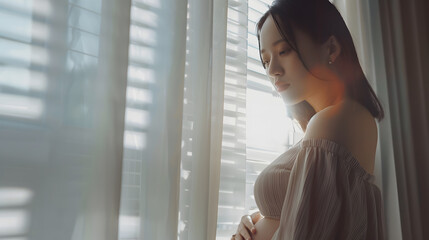 Pregnant woman standing against the window : Generative AI