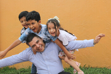 Divorced single dad has fun with his three dark-skinned Latino kids spending quality time and...