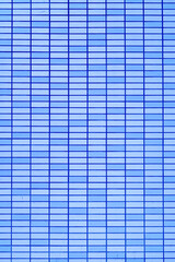 Blue tile wall. Abstract construction background.