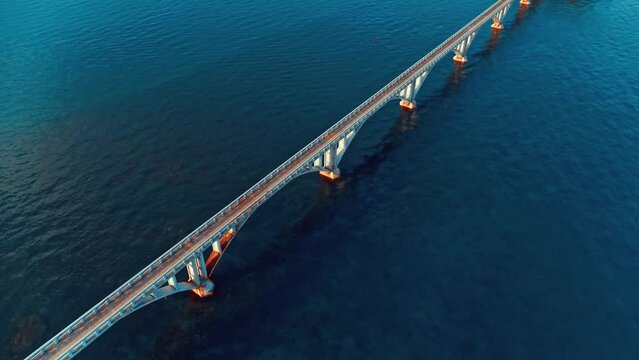 Bright summer view of the Atlantic Ocean. The road over the sea from top to bottom. Morning scene of "Bridge to Nowhere" in Santa Barbara de Samana. Beauty of nature concept background.