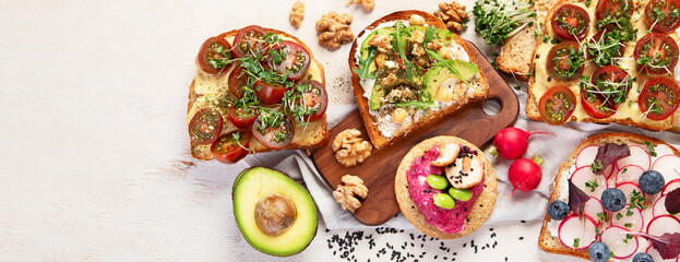 Breakfast with vegetables. toasts, tomato, cucumber, radish, avocado. Vegan healthy food concept
