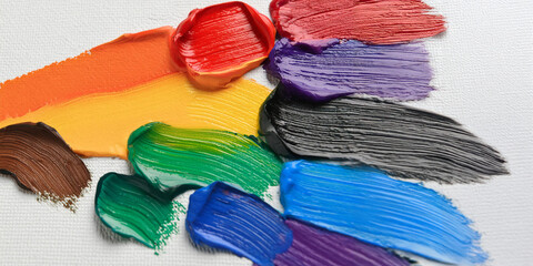 Beautiful colorful oil paints, painted on canvas in rainbow colors using a palette knife. Diversity concept.