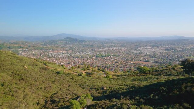 Densely Covered Forest Hills Overlooking Rural Suburbs Near Dixon Lake Campground In Escondido, California, USA. Aerial Drone Shot