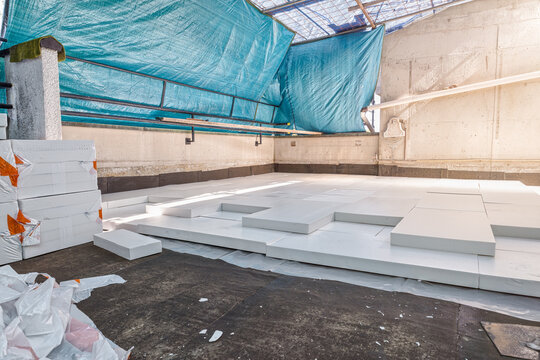 Styrofoam insulation sheets on house terrace with roof function for thermal protection on a bituminous membrane base with waterproofing function. Concept of energy efficiency