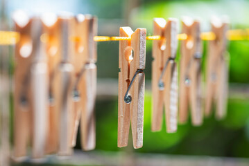 Clothespins on a clothesline in summer garden