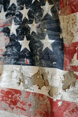 A close-up photo of an old, weathered American flag waving in the wind