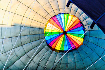 Interior of colorful hot air balloon filling with hot air
