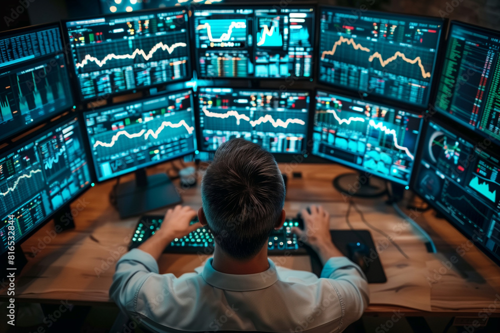 Poster a man is sitting in front of a computer monitor with multiple screens displaying financial data. he 