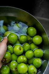 Green plum in a bowl