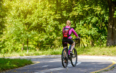 Cyclist ride on the bike path in the city Park
