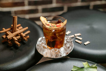 Refreshing Glass of Iced Tea With Cinnamon Stick