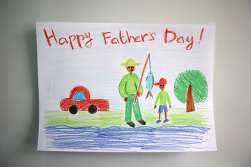 A Father's Day card drawn by a child. White background. Drawn by colored pencils. The postcard shows a father and son fishing. African appearance. Happy Father's Day lettering