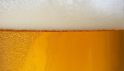 Closeup of beer with bubbles and foam in glass