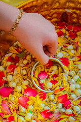 Pour water on the hands of revered elders and ask for blessing in Songkran Day.