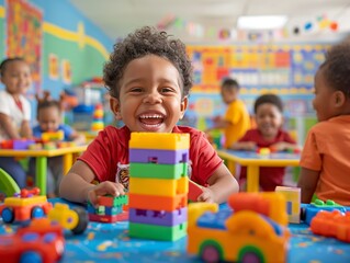 A preschool boy is playing with colorful plastic blocks in a classroom.