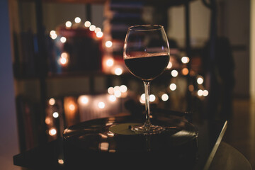 Glass of red wine in the romantic evening