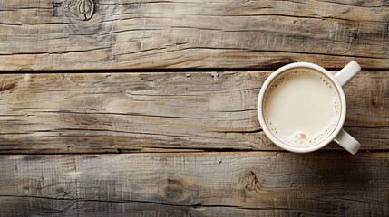 Cup of milk on wooden background
