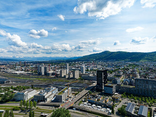 Aerial view of District Altstetten with skyscrapers and local mountain Uetliberg in the background...