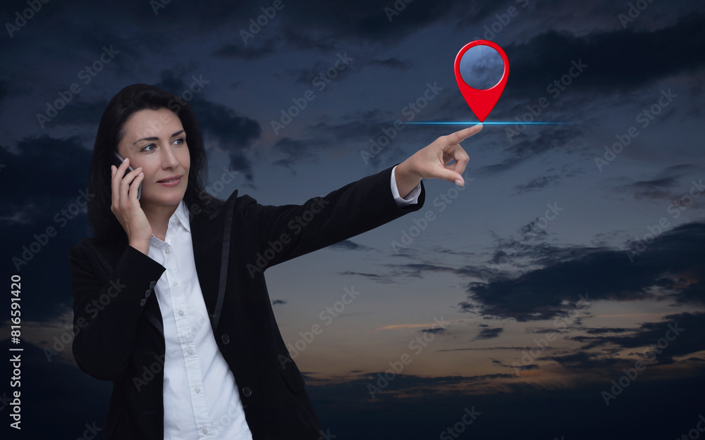 Poster businesswoman talking on her cell phone and pointing finger to map pin point location button over su