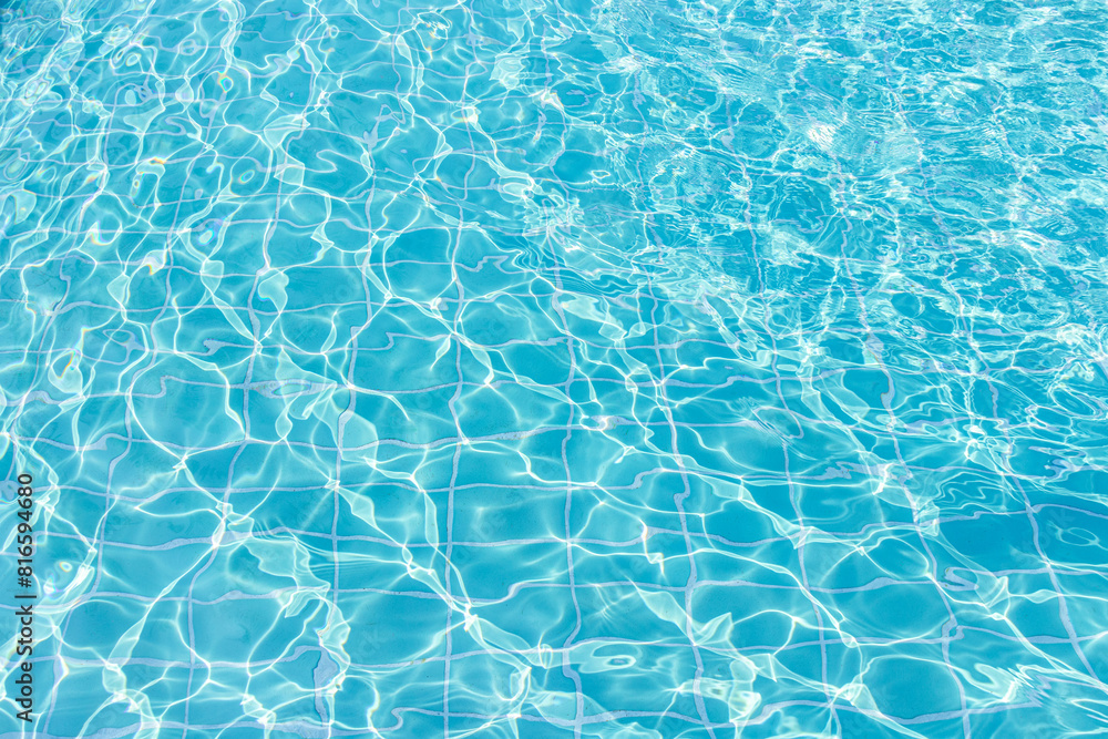 Sticker Blue swimming pool water surface and ripple wave background. Summer abstract reflection caustics in swimming pool.