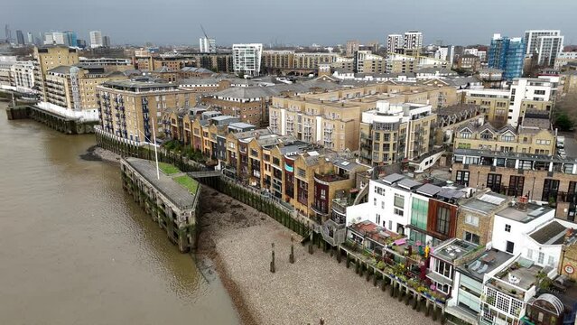 Wapping London UK riverside apartments Panning drone aerial