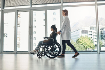 Wheelchair, doctor and walking with patient with disability in hospital for mobility impairment,...
