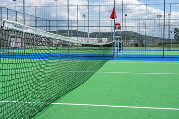 Part of the synthetic grass tennis court with markup