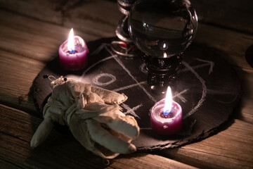 A detailed close-up shot of two lit pink candles with a dark, mystical background, emphasizing a...