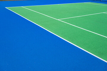 Part of the synthetic grass tennis court with markup