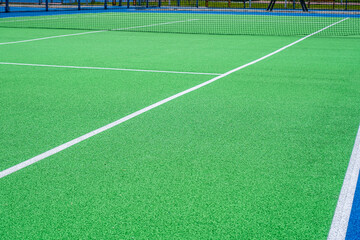 Part of the synthetic grass tennis court with markup