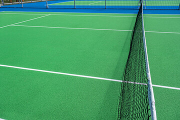 Part of the synthetic grass tennis court with markup