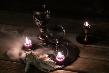 Mysterious Occult Ritual Setup with Crystal Ball and Candles.