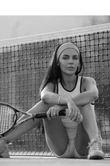 Young fit tennis player on tennis court. Sports woman. Beautiful Woman After Playing Tennis On Court. Portrait of Girl Holding Tennis Racket Resting After Training. Tenis for woman.