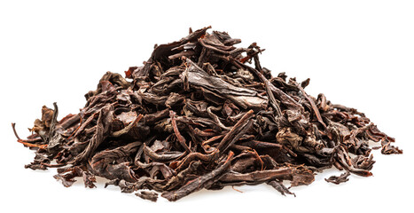 Heap of dried tea leaves isolated on white background. Closeup.