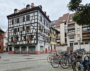 Fototapeta na wymiar Bikes in the street of the old town in Strasbourg, La Petite France, Strasbourg.