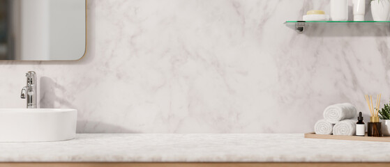 A modern, luxurious white marble bathroom countertop features a sink, a mirror, a toiletry set.