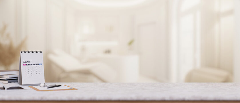 A doctor's office desk features a copy space on the desk in a modern luxurious clinic lounge.