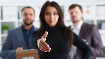 cheerful young businessmen are happy to work together friendly team woman lend hand acquaintance concept