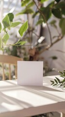 a greeting card on a table, simple white room, nature vibes for a mock up