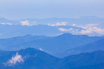 mountain valley in blue mist
