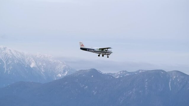 Air to Air Footage of Airplane Flying with Mountain Background