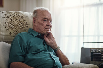 House, senior and man on sofa, thinking and memory in living room, treatment and healthcare of...