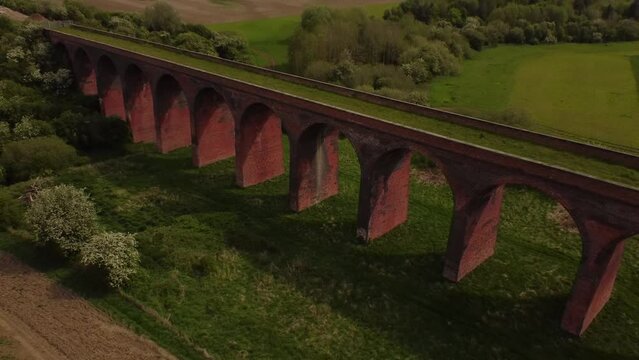 An aerial view of the Ledbury Viaduct bridge in England during daylight
