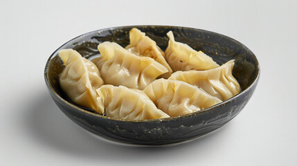 Plate with tasty dumplings on white background closeup