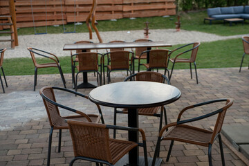 Outdoor coffee terrace with tables and chairs in a summer day