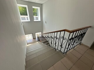 Long ceramic staircase with vintage handrails